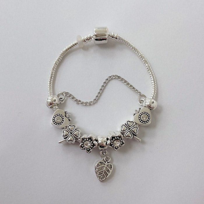Pulsera Dora con Dijes- Metal Blanco PAR075