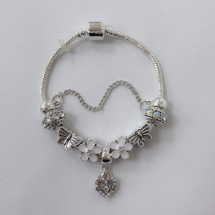 Pulsera Dora con Dijes- Metal Blanco PAR185