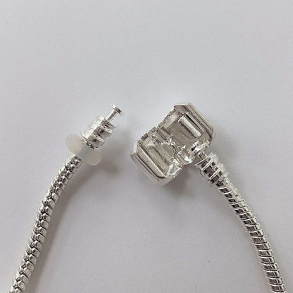 Pulsera Dora con 7 Dijes- Metal Blanco PAR059