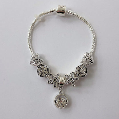Pulsera Dora con 7 Dijes- Metal Blanco PAR055