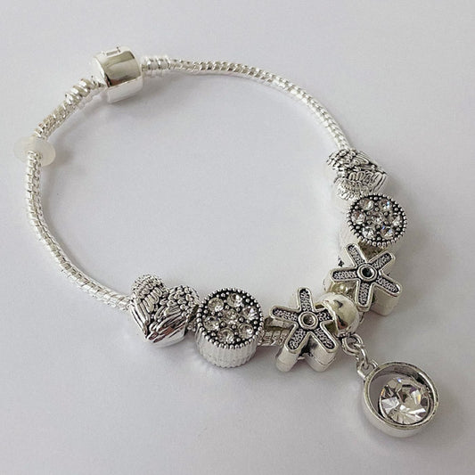 Pulsera Dora con 7 Dijes- Metal Blanco PAR055