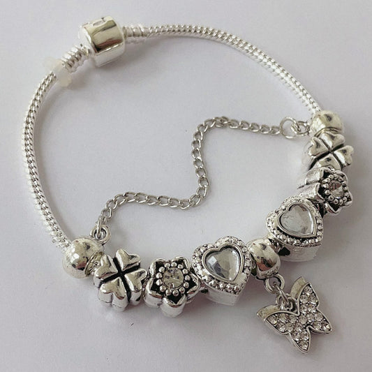 Pulsera Dora con 8 Dijes- Metal Blanco PAR065