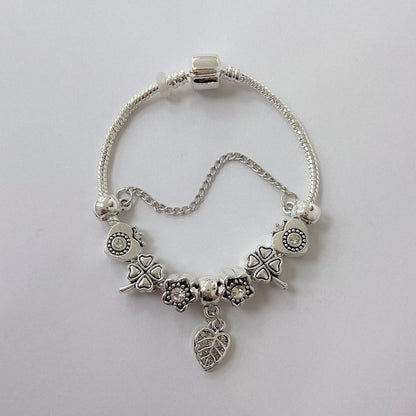Pulsera Dora con Dijes- Metal Blanco PAR075