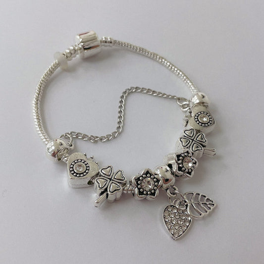 Pulsera Dora con Dijes- Metal Blanco PAR075
