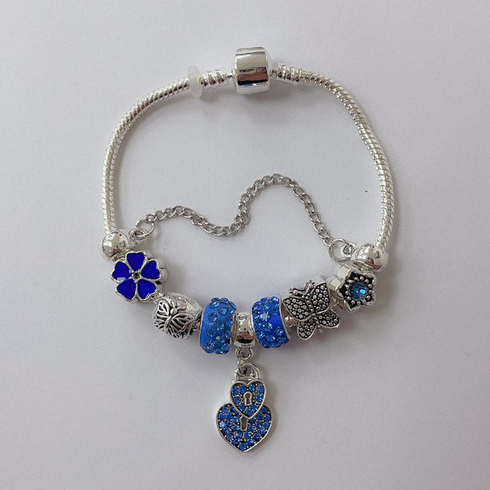 Pulsera Dora con Dijes- Metal Blanco PAR083