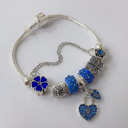 Pulsera Dora con Dijes- Metal Blanco PAR083