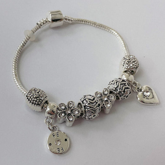 Pulsera Dora con Dijes- Metal Blanco PAR084