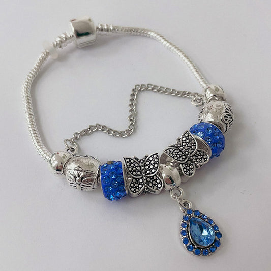 Pulsera Dora con Dijes- Metal Blanco PAR169