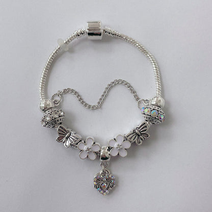 Pulsera Dora con Dijes- Metal Blanco PAR185