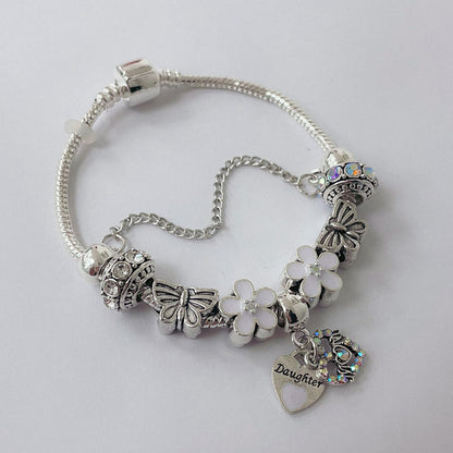 Pulsera Dora con Dijes- Metal Blanco PAR185