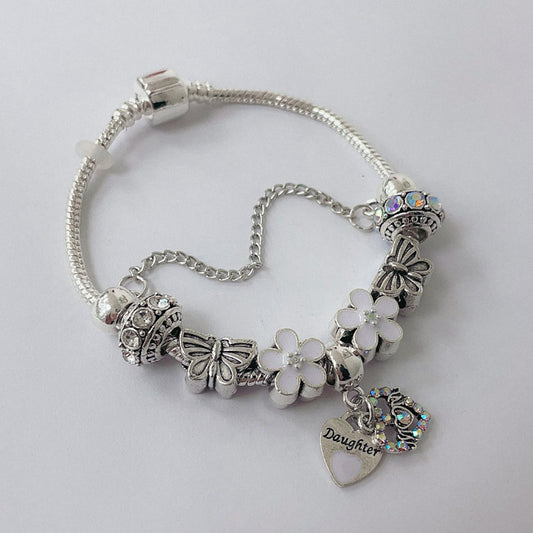 Pulsera Dora con Dijes- Metal Blanco PAR185
